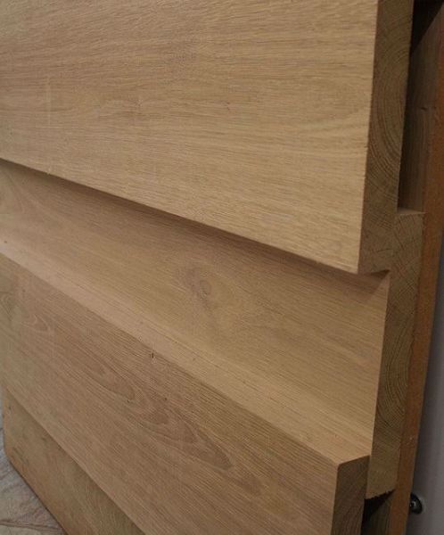 Board on Board cladding in Oak. Available in a variety of widths from EC Forest Products.